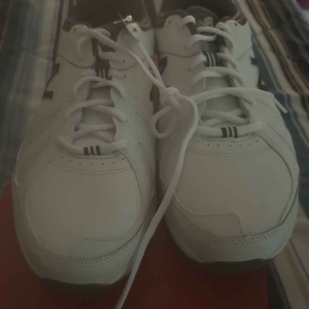 New in box Mens New Balance 519 shoes. These are 11.5 4 extra wide.